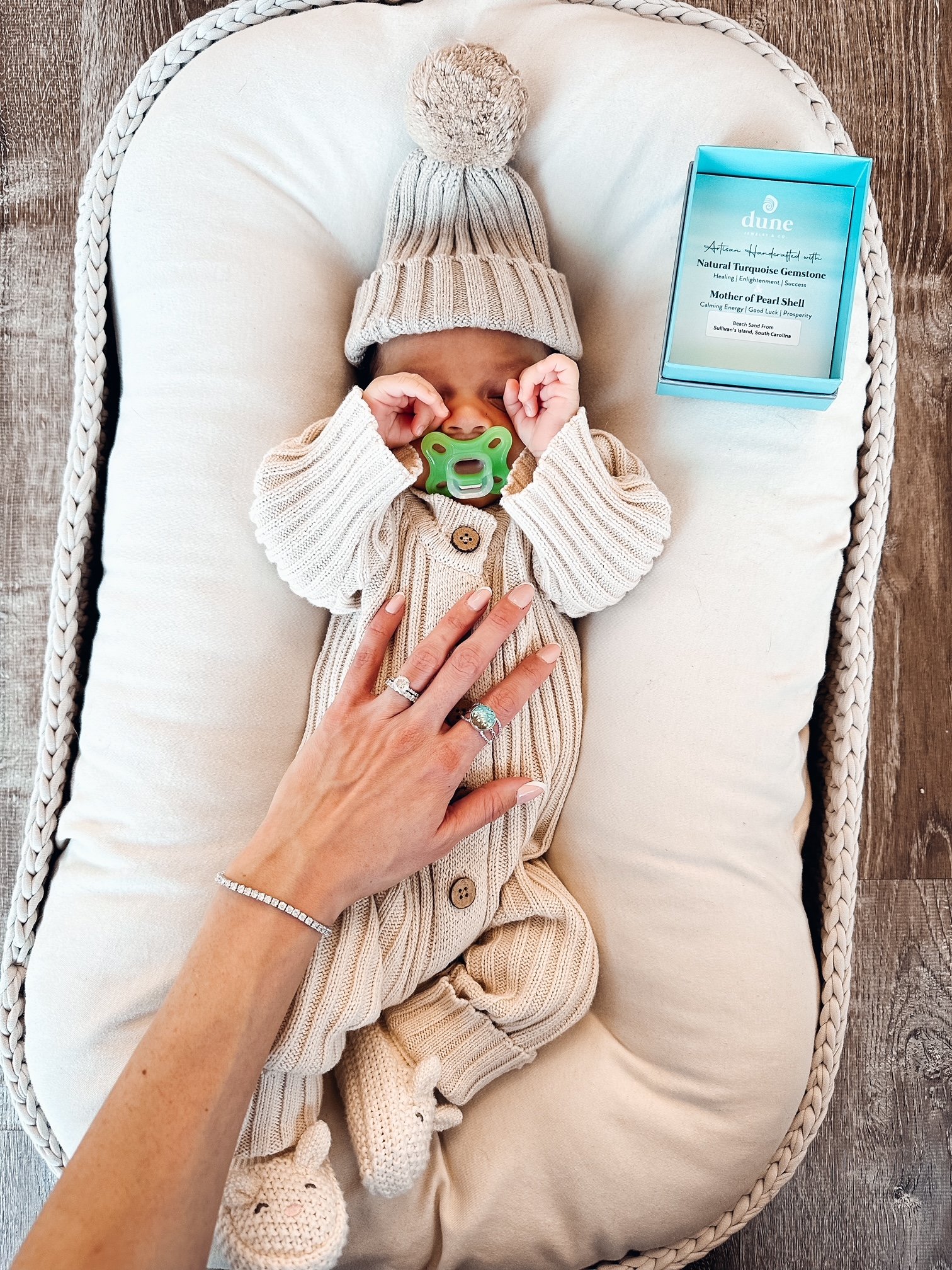 Influencer Jen Dewitt's photo of her baby and her hand wearing Artful Bracelets's round Boho Ring, the perfect Mother's Day Gift.