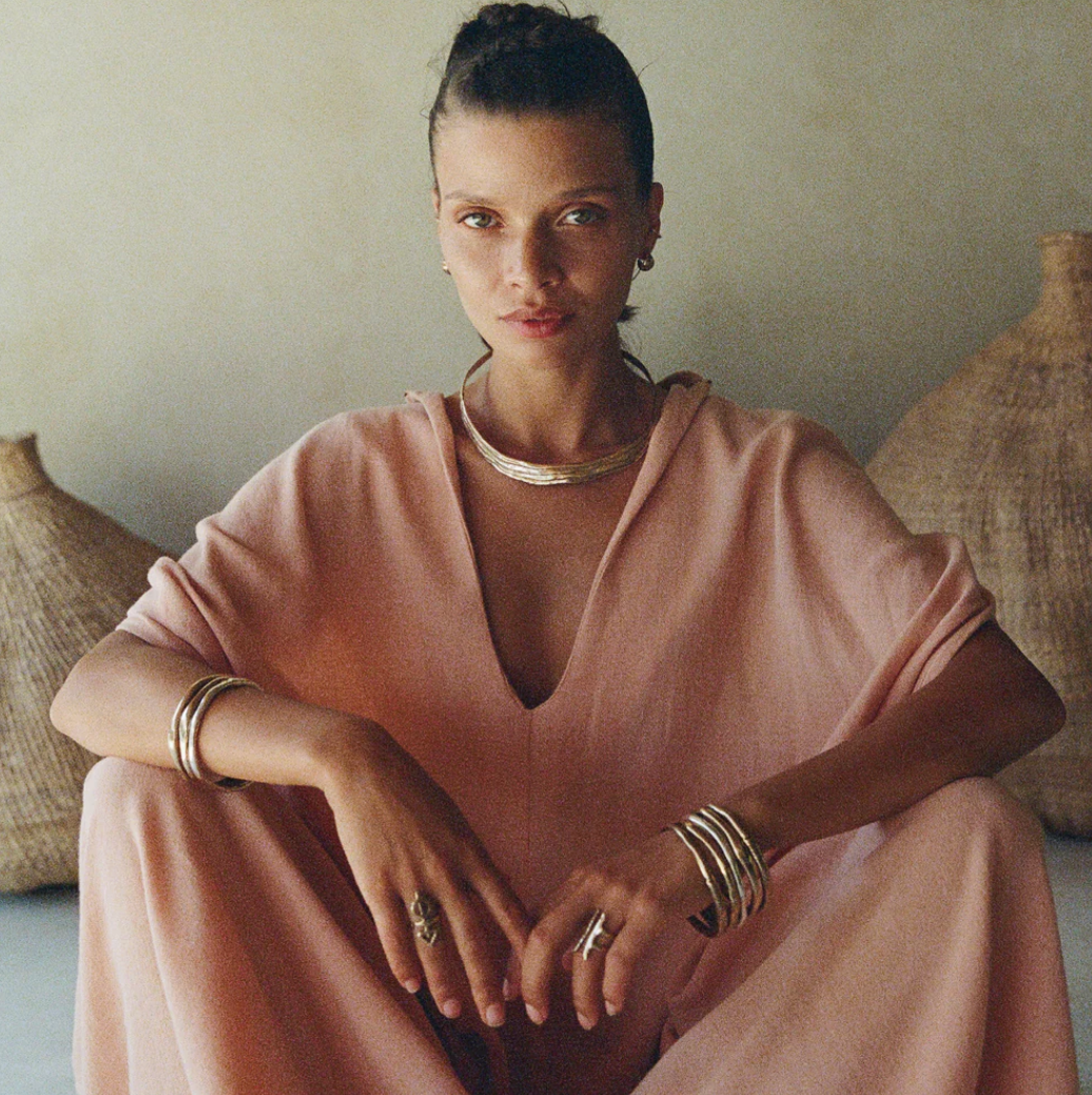 Photo of woman wearing the Chantara Collar, Reclaimed Solid Polished Bronze, 925 Sterling Silver, and Gold for Artful Bracelets's sustainable jewelry blog.